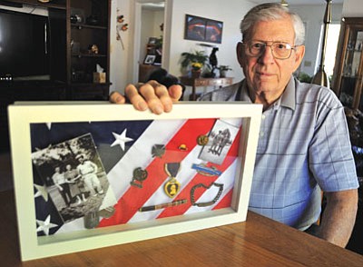 Nels Gunnar Ohlson had to give up his right leg when he was wounded in World War II. (Matt Hinshaw/The Daily Courier)
