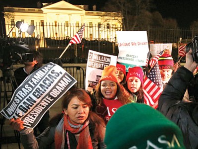 People chant during a demonstration in front of the White House in Washington on Thursday. (Alex Brandon/The Associated Press)