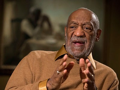 In this Nov. 6, 2014, file photo, entertainer Bill Cosby gestures during an interview about the upcoming exhibit, "Conversations: African and African-American Artworks in Dialogue," at the Smithsonian's National Museum of African Art in Washington. Cosby's appearance at Tuscon’s Desert Diamond Casino has been canceled. No reason was given by the casino for the canceled date, which had been scheduled for Feb. 15. In the past week, numerous allegations of sexual abuse by Cosby from a number of women have led to canceled interviews and NBC and Netflix projects. (Associated Press photo/Evan Vucci)