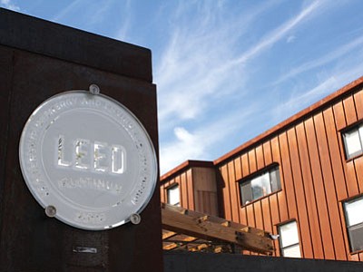 A LEED Platinum plaque installed on the outer gate of Prescott College’s Village housing complex. (Courtesy photo)