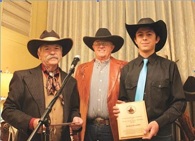 Courtesy photo<br>Jordan Brambila accepts the Western “Heritage Keeper” Scholarship and recognition plaque from Dennis Gallagher, Prescott Western Heritage Foundation President. Left to right are Dennis, Terry Horne and Jordan.