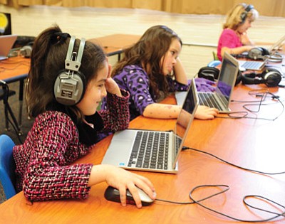 Les Stukenberg/The Daily Courier<br /><br /><!-- 1upcrlf2 -->First graders Cierra Perez, Kayla Jervik and Bailey Wright work in the computer lab period in a blended learning model at Washington School in Prescott.