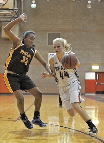 Matt Hinshaw/The Daily Courier<br>Bradshaw’s Ashlie Dowdy, right, drives toward the hoop while Marcos de Niza’s Angelicah Tso (33) tries to block her path Tuesday night in Prescott Valley.