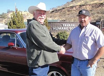 Courtesy photos<br>
Pat O’Brien congratulates Terry Ligon on winning a restored 1966 Ford Ranchero Jan. 9. O’Brien donated the classic car to the Yavapai Humane Society for a fundraising raffle.