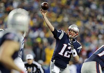 New England Patriots quarterback Tom Brady throws a pass during the first half of the AFC championship NFL football game against the Indianapolis Colts in Foxborough, Mass.