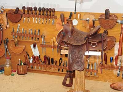 Les Stukenberg/The Daily Courier<br /><br /><!-- 1upcrlf2 -->Pleasant Valley Saddle Shop’s Dusty Johnson has salesman sample saddles ready for the upcoming art and leather shows in Prescott. <b>Pick up Friday’s Kudos for more coverage.</b>