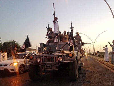 Islamic State fighters in June 2014. (AP file photo)
