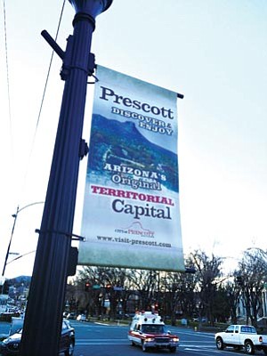 Cindy Barks/The Daily Courier<br>The City of Prescott currently uses 138 poles in the downtown area to promote 10 different aspects of Prescott, including this Goodwin Street banner featuring Arizona’s Original Territorial Capital.