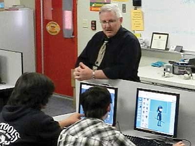 Courtesy photo<br>
Rob Lynch, the Advanced Technology teacher at Heritage Middle School, works with students in the class.