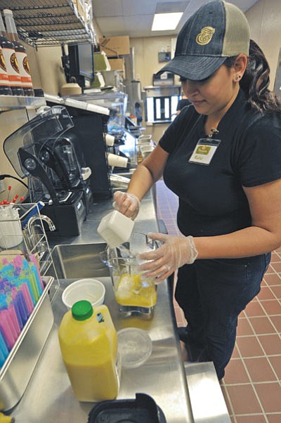 Kelsi Popik, Panera Bread Service Associate, practices making a Mango Smoothie Wednesday afternoon during employee training in Prescott. Panera Bread is set to open on Monday, April 27 at the Prescott Gateway Mall near Red Robin. (Photo by Matt Hinshaw/The Daily Courier)