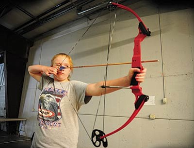 Les Stukenberg/The Daily Courier<br>Trinity Phares, practicing archery at Prescott Valley Charter School on Monday, is off to compete at a national tournamen this week.
