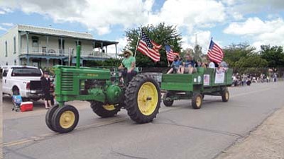Courtesy<br>All American tractor participants in the Mayer Daze parade.