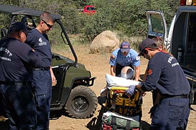 Scott Orr/Daily Courier<br /><br /><!-- 1upcrlf2 -->A man who fell on Trail 62 in the Prescott National Forest is checked by paramedics before being taken to a hospital Wednesday, June 17.