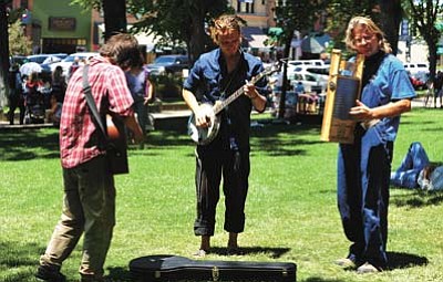 Les Stukenberg/The Daily Courier<br>Will Waller, Lucas Gils and Normal T, part of the band the Butte Creek Boys, jam during last year’s Prescott Bluegrass Festival.