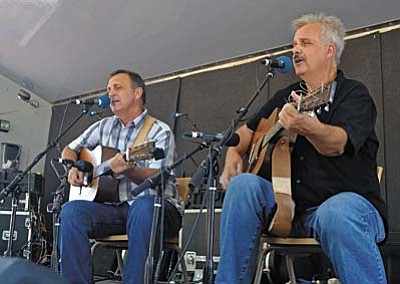 Prescott 06-27-15<br /><br /><!-- 1upcrlf2 -->Matt Hinshaw/The Daily Courier<br /><br /><!-- 1upcrlf2 -->Eric Uglum and Bud Bierhaus also known as The Vintage Martins perform for the crowd during the 34th Annual Prescott Bluegrass Festival in downtown Prescott.