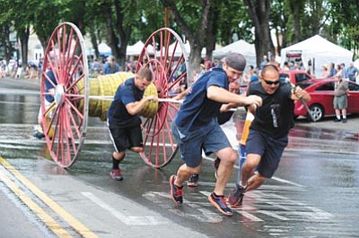 Central Yavapai’s C Shift team pulls out the hose during the 2015 Hose Cart Races Sunday, July 5, along Cortez Street in Prescott. (Photos by Les Stukenberg/<br /><br /><!-- 1upcrlf2 -->The Daily Courier)