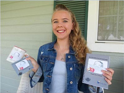 Rebecca Shaver poses with some of the items for sale at Catholic Charities and northstaryouth.org. (Courtesy photo)