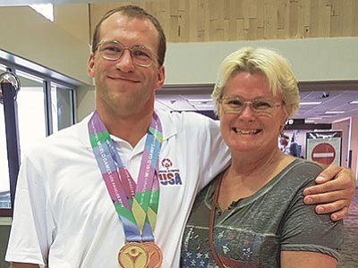 Courtesy photo<br>
Jeremiah Schedlock of Prescott traveled to Los Angeles with his mother, Debbie Curry, to compete in three events of the 2015 Special Olympics World Games the week of July 26. Jeremiah won a gold medal in working trail riding and a bronze medal in dressage. He also placed fifth in English equitation.