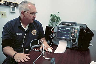 Courtesy photo/City of Prescott<br>Prescott Fire Department Division Chief Don Devendorf demonstrates the new cardiac care equipment the City of Prescott recently purchased.
