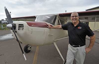 Dave Roy, director of Safety and Communications for Guidance Aviation, stands next to his 1947 Cessna 140 at the Prescott Airport. Roy is a graduate of Embry-Riddle Aeronautical University.<br /><br /><!-- 1upcrlf2 -->(Matt Hinshaw/The Daily Courier)