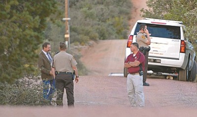 Matt Hinshaw/The Daily Courier<br>
Sheriff's Office Deputies and Sheriff Scott Mascher work the scene of a Deputy involved shooting on Marlow Road in Williamson Valley Wednesday evening.