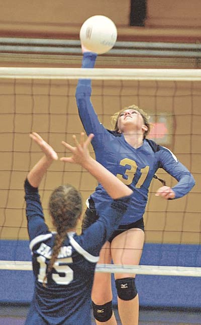 Matt Hinshaw/The Daily Courier<br /><br /><!-- 1upcrlf2 -->Prescott's Abbey Smith (31) hits the ball over the net while Cactus Shadow's Lily Cristante (15) tries to block her Thursday night at Prescott High School.