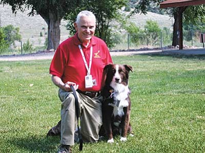 Courtesy photo<br>
Northern Arizona Veteran Affairs Health Care System veteran and volunteer Don Packard poses with his service dog, Sailor.