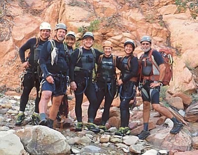 This photo released by National Park Service shows from left to right: Gary Favela, Don Teichner, Muku Reynolds, Steve Arthur, Linda Arthur, Robin Brum, and Mark MacKenzie. The hikers, six from California and one from Nevada, died when fast-moving floodwaters rushed through a narrow park canyon Monday, Sept. 14, 2015. (National Park Service via AP)