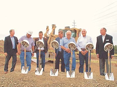 Business and community leaders prepare for a ceremonial groundbreaking at a 160-unit apartment complex under construction on Willow Creek Road. From left, Arizona Multihousing Association President and CEO Tom Simplot, DECCA Builders Inc. Vice President John Wareing, Paul Johnson Drywall Inc. President Cole Johnson, DECCA Builders Inc. President Michael Wareing, Parlay LLC project manager Tim Emberlin, Prescott Mayor Marlin Kuykendall and Allison-Shelton Real Estate Services Principal Thomas Shelton.