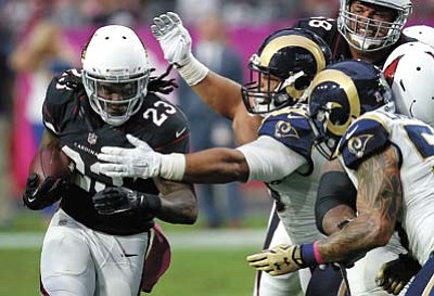 Arizona Cardinals running back Chris Johnson (23) runs against the St. Louis Rams during the first half Sunday, Oct. 4, in Glendale. (Rick Scuteri/The Associated Press)