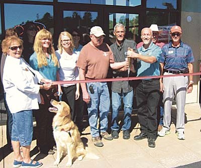 Courtesy photo<br>The ribbon is cut to open the Yavapai Humane Society Thrift Store Oct. 10, 2014. The YHS is celebrating the store’s one-year anniversary with special sales all week long.