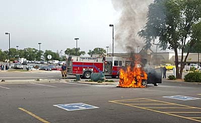 Kalee Morris/Courtesy photo<br /><br /><!-- 1upcrlf2 -->Firefighters arrive at the scene of a vehicle fire Thursday morning in the parking lot of Pet Club in Chino Valley.