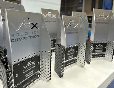 Metal trophies wait to be claimed Saturday morning during the first VEX U Robotics Competition at ERAU in Prescott.