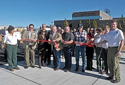 Matt Hinshaw/The Daily Courier<br>State, federal, county, and city officials cut a ribbon to officially open the expansion of the Air Tanker Base located at the Henry YH Kim Prescott Fire Center Thursday afternoon at the Prescott Airport.  The air tanker base has been in operation since 1958.