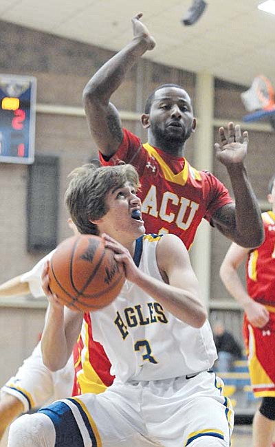 Prescott 12-02-15<br /><br /><!-- 1upcrlf2 -->Matt Hinshaw/The Daily Courier<br /><br /><!-- 1upcrlf2 -->Embry-Riddle's Nick Agostino (3) goes up for a shot while Arizona Christian's Brandon Newman (3) tries to block him Wednesday night at ERAU in Prescott.
