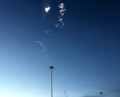 Erin Dorrance/White Sands Missile Range via AP<br>
This Thursday, Dec. 10, 2015 photo provided by White Sands Missile Range shows an exhaust plume from a missile launch over N.M. An early morning missile test in New Mexico left a white contrail that quickly turned into a corkscrew that was visible for hundreds of miles. The unarmed Juno target missile was launched at 6:55 a.m. MST from an old military depot in northwestern New Mexico. 
