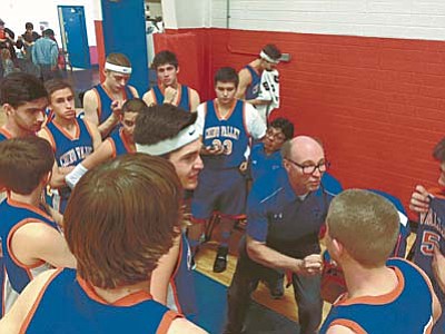 Brian M. Bergner Jr./The Daily Courier<br /><br /><!-- 1upcrlf2 -->Chino Valley basketball players look on as head coach Mike Fogel talks about being strong with the basketball during halftime at the Mayer Holiday Basketball Tournament on Saturday.