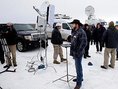Rick Bowmer/The AP<br>
Ammon Bundy, one of the sons of Nevada rancher Cliven Bundy, speaks during an interview at Malheur National Wildlife Refuge, Tuesday, Jan. 5, near Burns, Oregon. Law enforcement had yet to take any action Tuesday against a group numbering close to two dozen, led by Bundy and his brother, who are upset over federal land policy.
