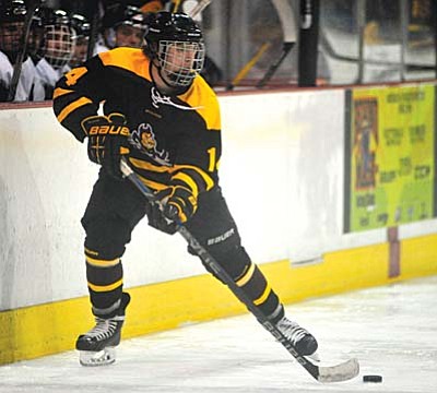 ASU’s Auston Ehrlich moves the puck along the boards as the ASU Sun Devils took on the NAU Ice Jacks in  an ACHA Division 2 hockey matchup at the Prescott Valley Event Center Friday. ASU came out on top in convincing fashion with a 5-1 victory.<br /><br /><!-- 1upcrlf2 -->Les Stukenberg/The Daily Courier