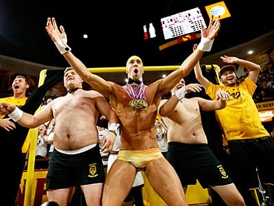 Matt York/The AP<br>
Olympic swimmer Michael Phelps, center, performs behind the "Curtain of Distraction" during an Oregon State free throw against Arizona State on Thursday, Jan. 28, in Tempe. The Oregon State player missed both shots.