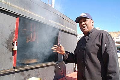 Max Efrein/The Daily Courier<br>Aron Crisp, owner of Aron’s BBQ, has more than 50 years of barbecuing experience. Now 71 years old, he opened his first barbecue restaurant in Texas when he was 19. 
