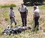 Courier/Jo. L. Keener
Officers from the Arizona Department of Public Safety and Yavapai County Sheriff¹s Office investigate the scene of a motorcycle crash at Highway 69 and Fain Road. 
