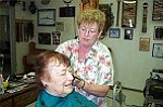 Courier/Ken Hedler
Chino Valley barber Birdie Bennett cuts Jane Deitchman¹s hair on a recent morning. Bennett has owned a barber shop in town for 21 years.