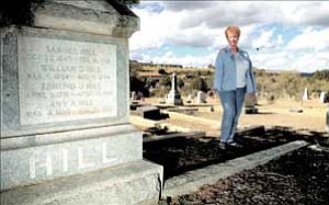 Courier/Les Stukenberg
Judy Branson walks through Odd Fellows Cemetery studying tombstones. The September issue of Good Housekeeping magazine features Branson’s findings.
