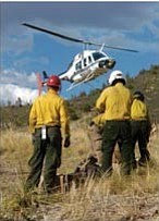 Courier/Les Stukenberg
Helicopter 530 flies members of the Flagstaff Hotshots into the Slate fire late Wednesday afternoon. The fire, discovered earlier in the afternoon, is in an area inaccessible to vehicles.