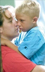 Courier/Les Stukenberg
Kimberly Nelson comforts her son, Quentin, as he goes to his first day of school in first grade at Taylor Hicks Elementary School in Prescott Monday morning.