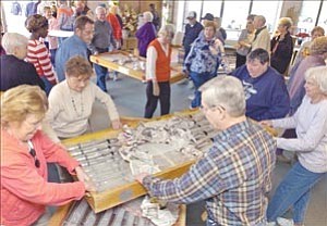 Courier/Nathaniel Kastelic
Seventy-five members and friends of the American Evangelical Lutheran Church in Prescott team up to help carry more than 1,800 organ pipes for a new Schantz Pipe Organ into the church Monday.