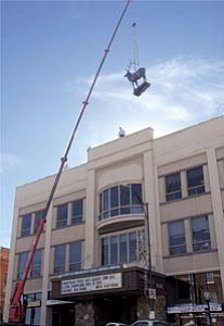Courier/Les Stukenberg

A crane from A&B Signs raises the elk, after a 30-plus year absence, back to the top of the Elks Opera House in downtown Prescott in December.