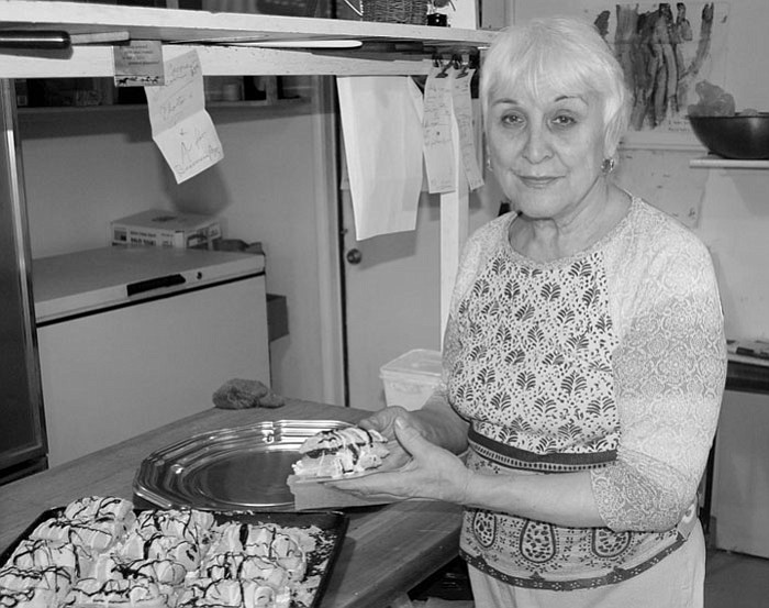 The Daily Courier/Jason Soifer
Geraldine Thomas, owner of Grama’s Bakery and real-life grandmother, stands next to a tray of napoleons Wednesday afternoon.
