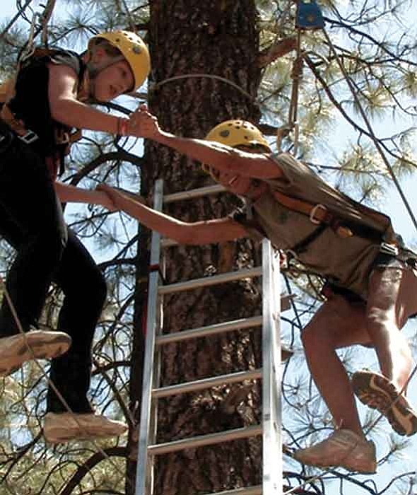 The Daily Courier/Les Stukenberg
Campers Alicia, left, and Chelsea use trust and balance to start moving their way along the high Y at Camp Courage on Wednesday in this still photo made from video.
